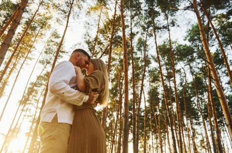 In the forest at daytime. Happy couple is outdoors